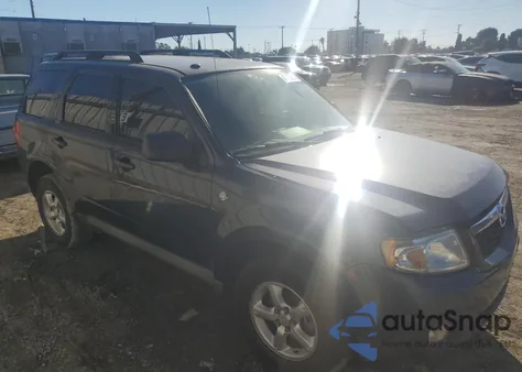 2009 Mazda Tribute Hybrid z USA, uszkodzony, nr VIN 4F2CZ49319KM07138